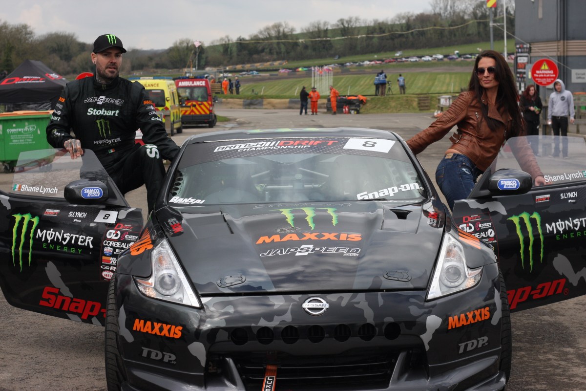Torie Campbell and Shane Lynch getting into the Team Japspeed Drift car.